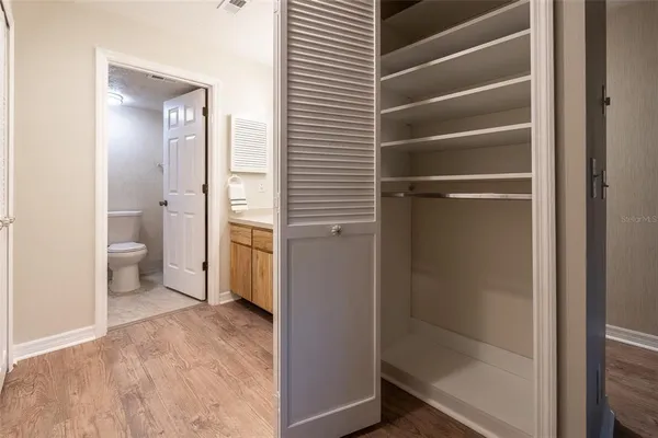 a bathroom view with a toilet and a shower