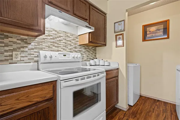 a kitchen with a stove and a microwave