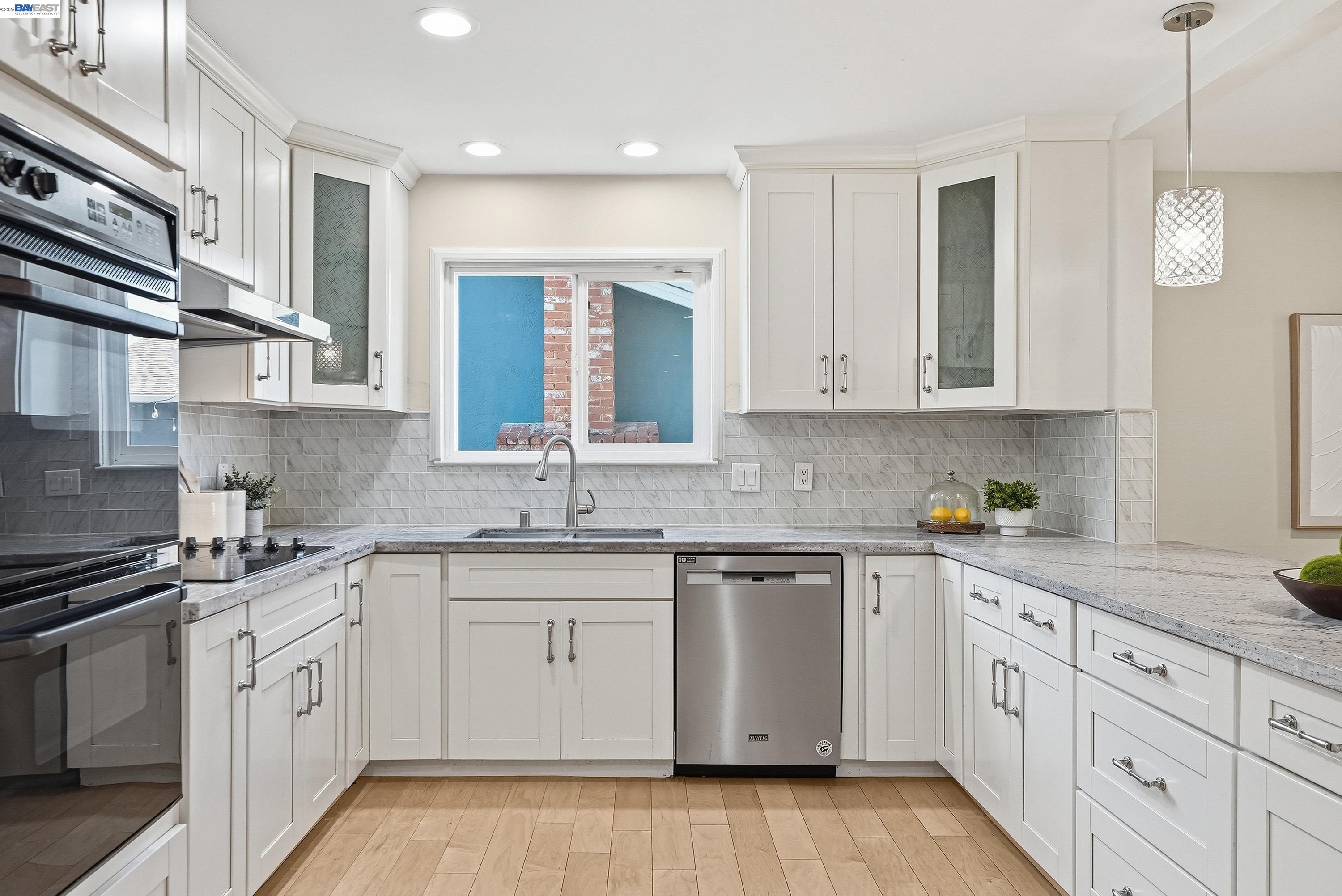 1621 Harvest Road Pleasanton, CA 94566 - Photo 11 of 52 a kitchen with white cabinets stainless steel appliances and sink