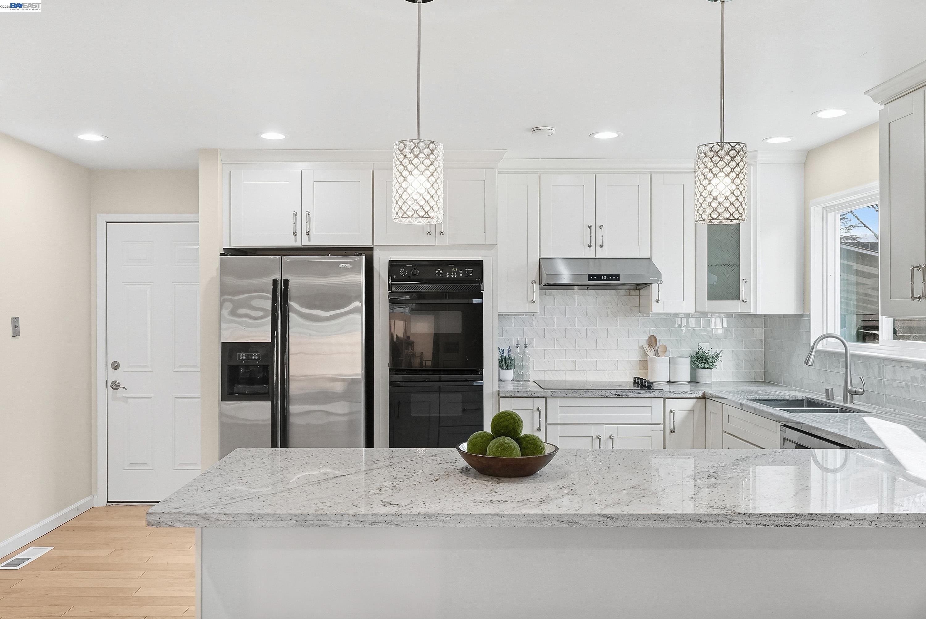 1621 Harvest Road Pleasanton, CA 94566 - Photo 12 of 52 a kitchen with stainless steel appliances granite countertop a refrigerator a sink and a stove
