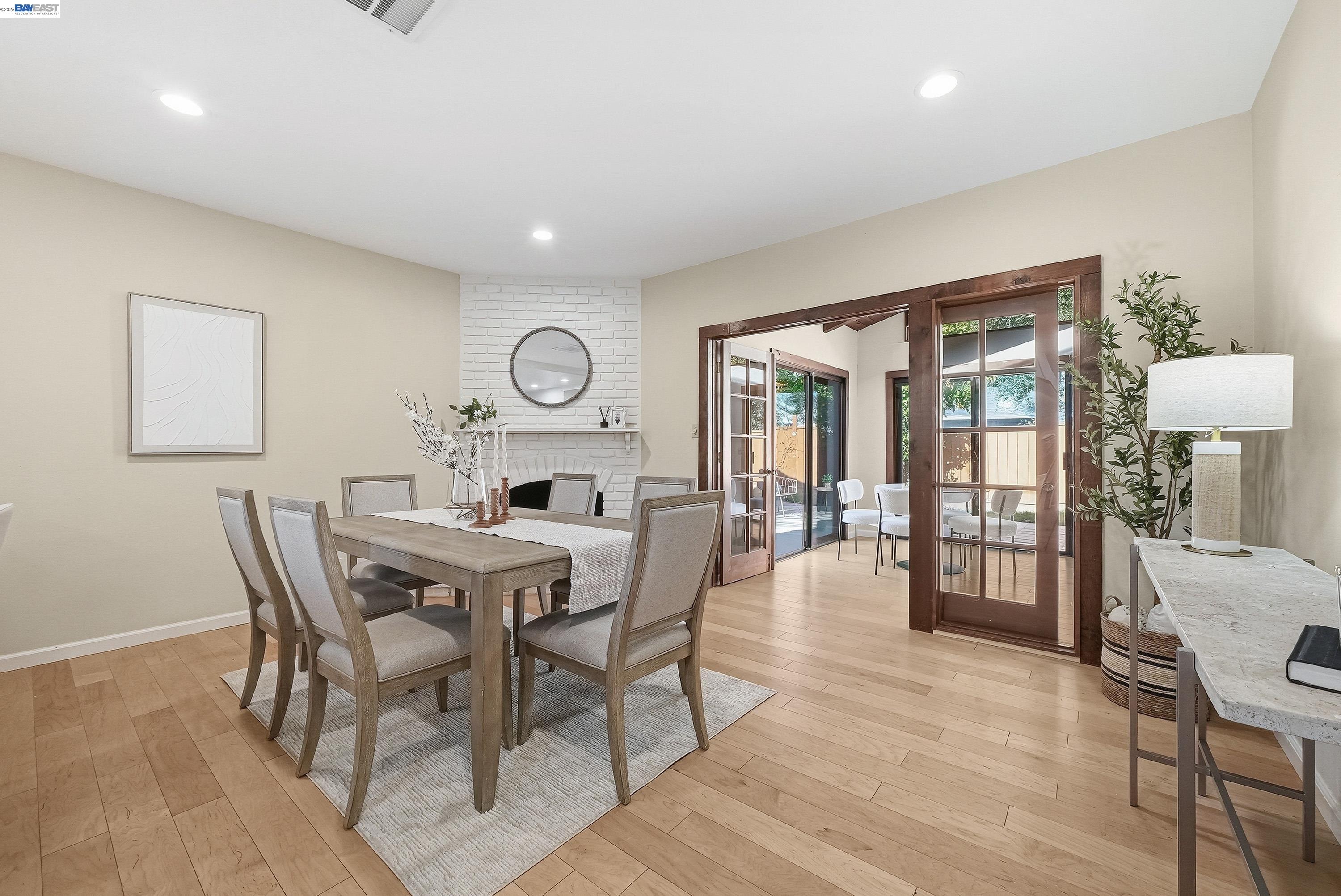 1621 Harvest Road Pleasanton, CA 94566 - Photo 16 of 52 a view of a dining room with furniture and wooden floor