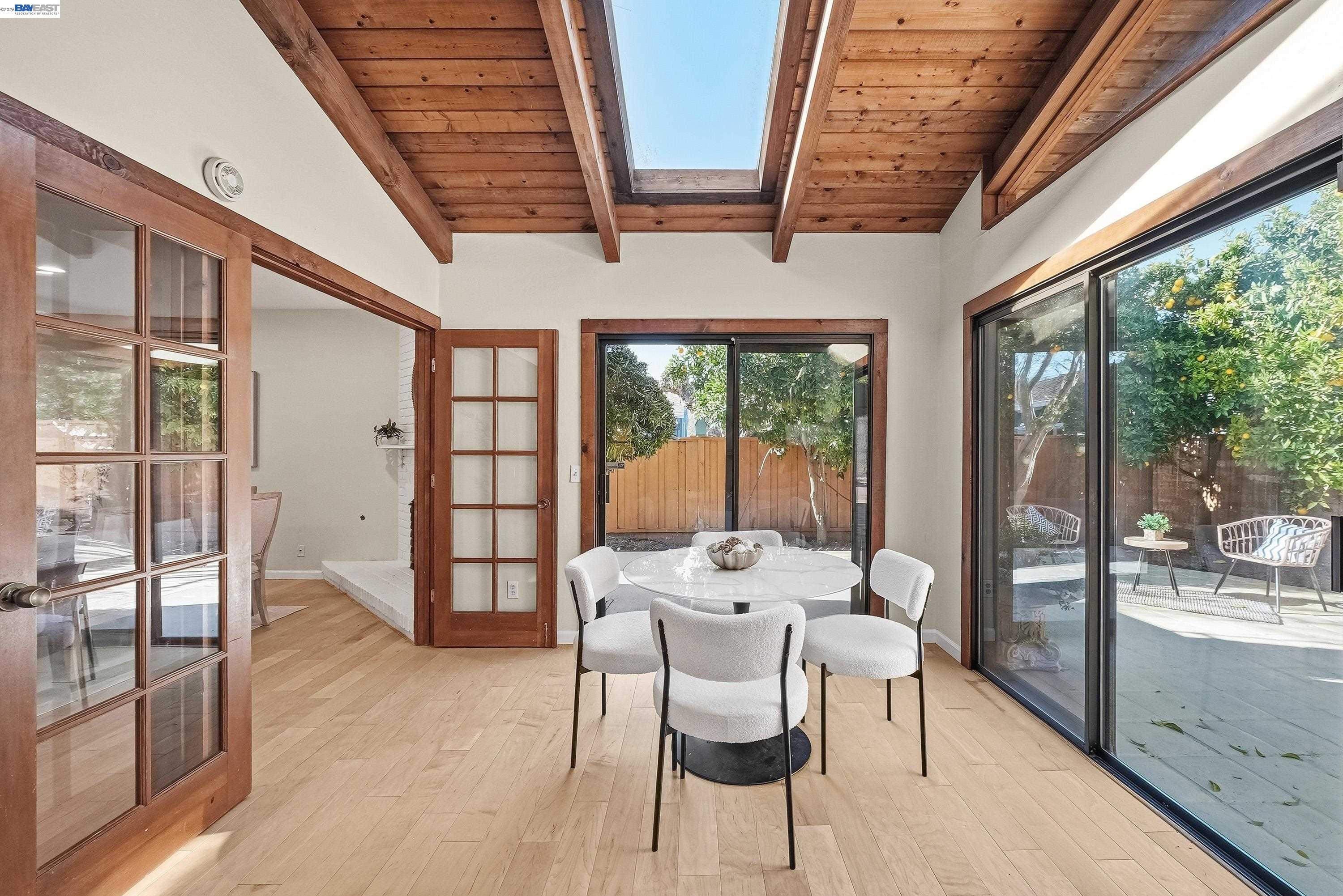 1621 Harvest Road Pleasanton, CA 94566 - Photo 21 of 52 a dining room with furniture and large windows