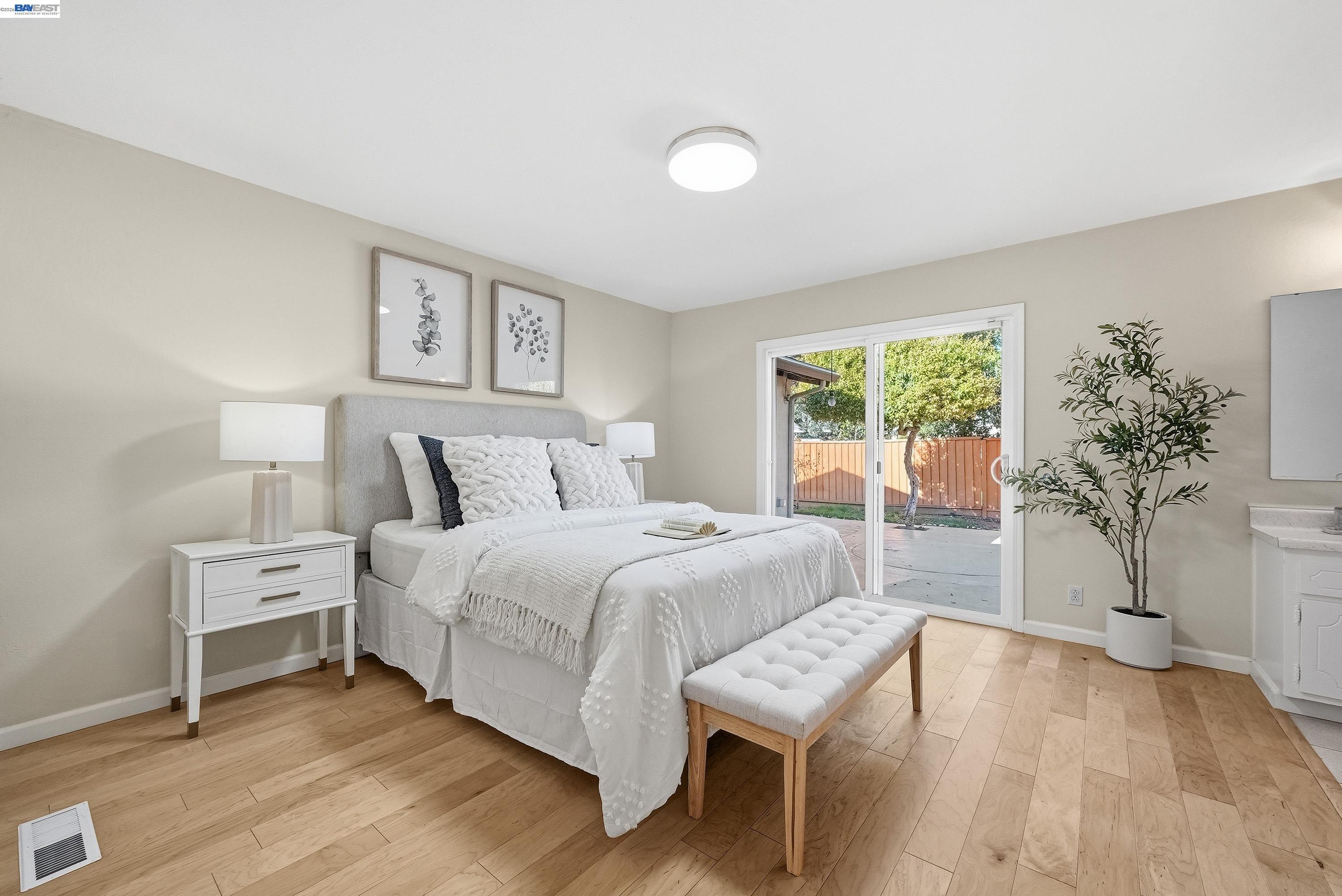1621 Harvest Road Pleasanton, CA 94566 - Photo 26 of 52 a bedroom with a bed and a potted plant