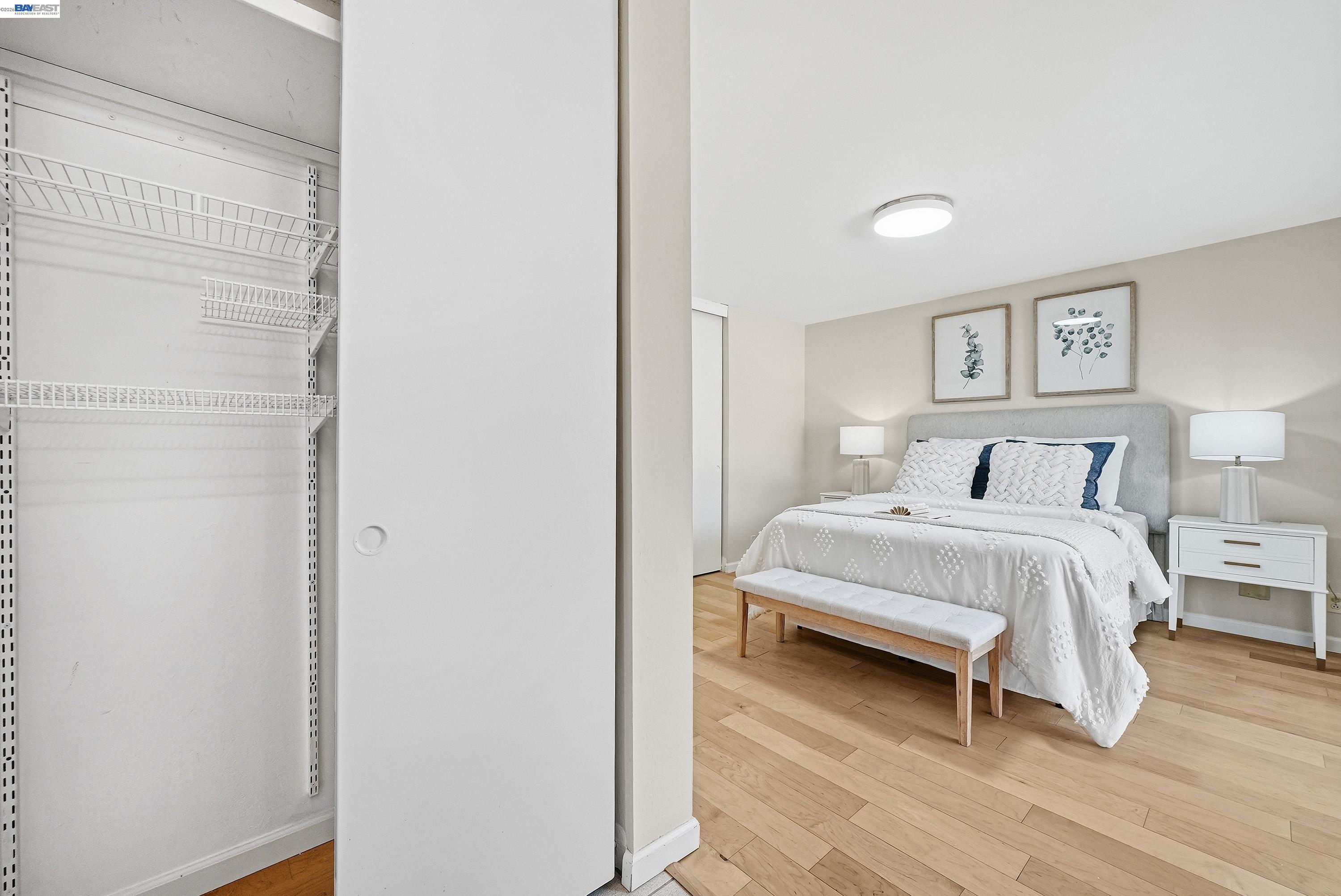 1621 Harvest Road Pleasanton, CA 94566 - Photo 29 of 52 a bedroom with a bed and a painting on the wall