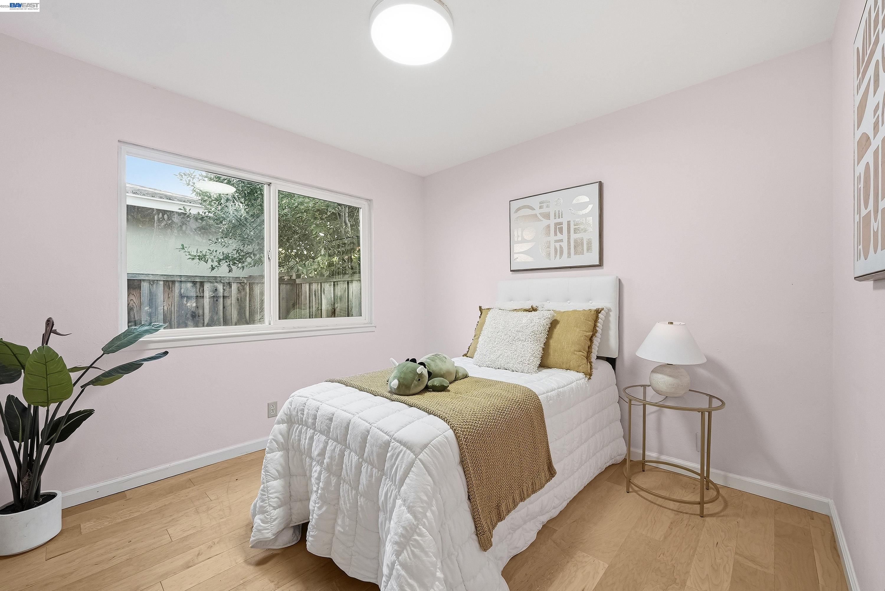1621 Harvest Road Pleasanton, CA 94566 - Photo 35 of 52 a bedroom with a bed and a potted plant