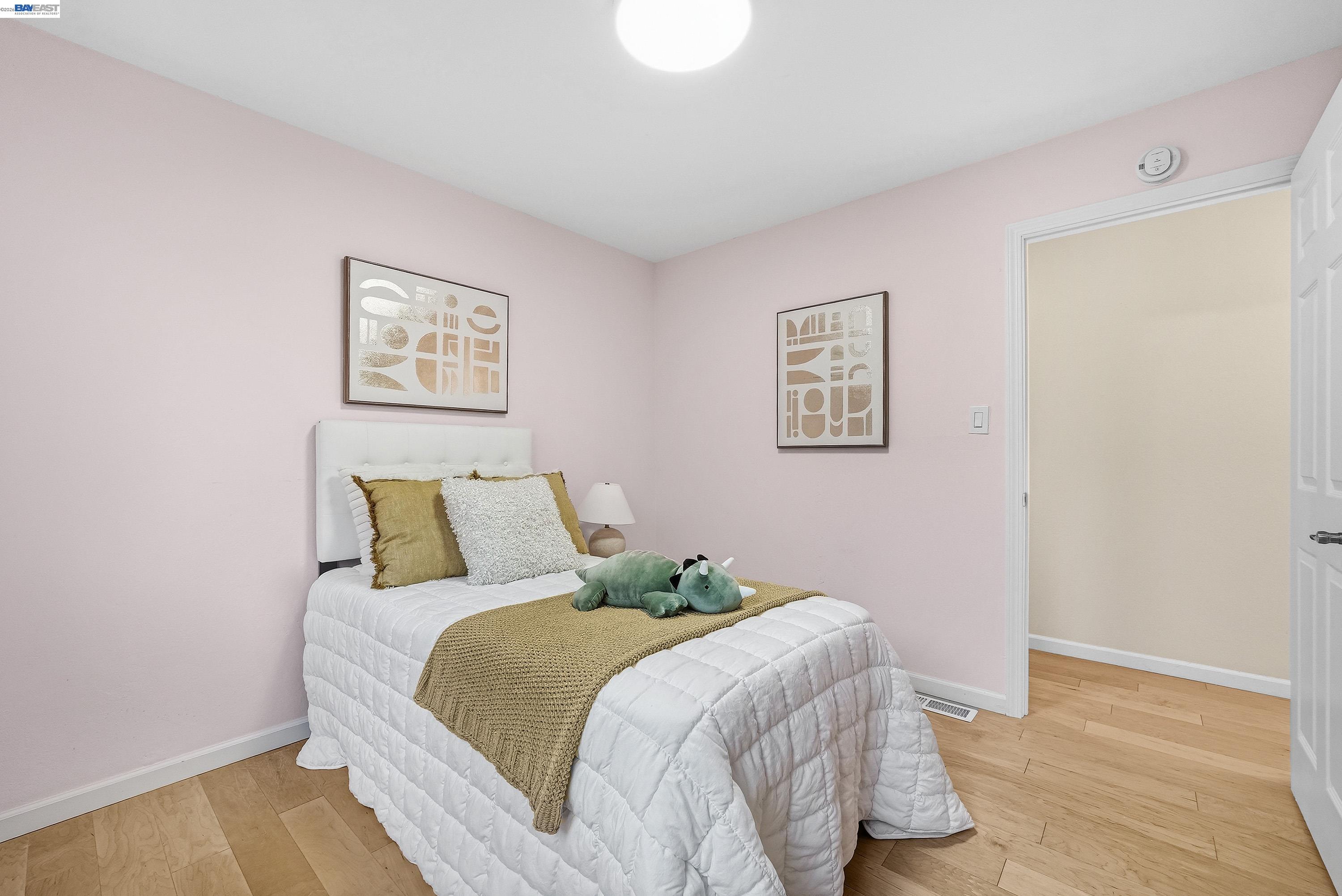 1621 Harvest Road Pleasanton, CA 94566 - Photo 36 of 52 a bed room with a bed and a painting on the wall