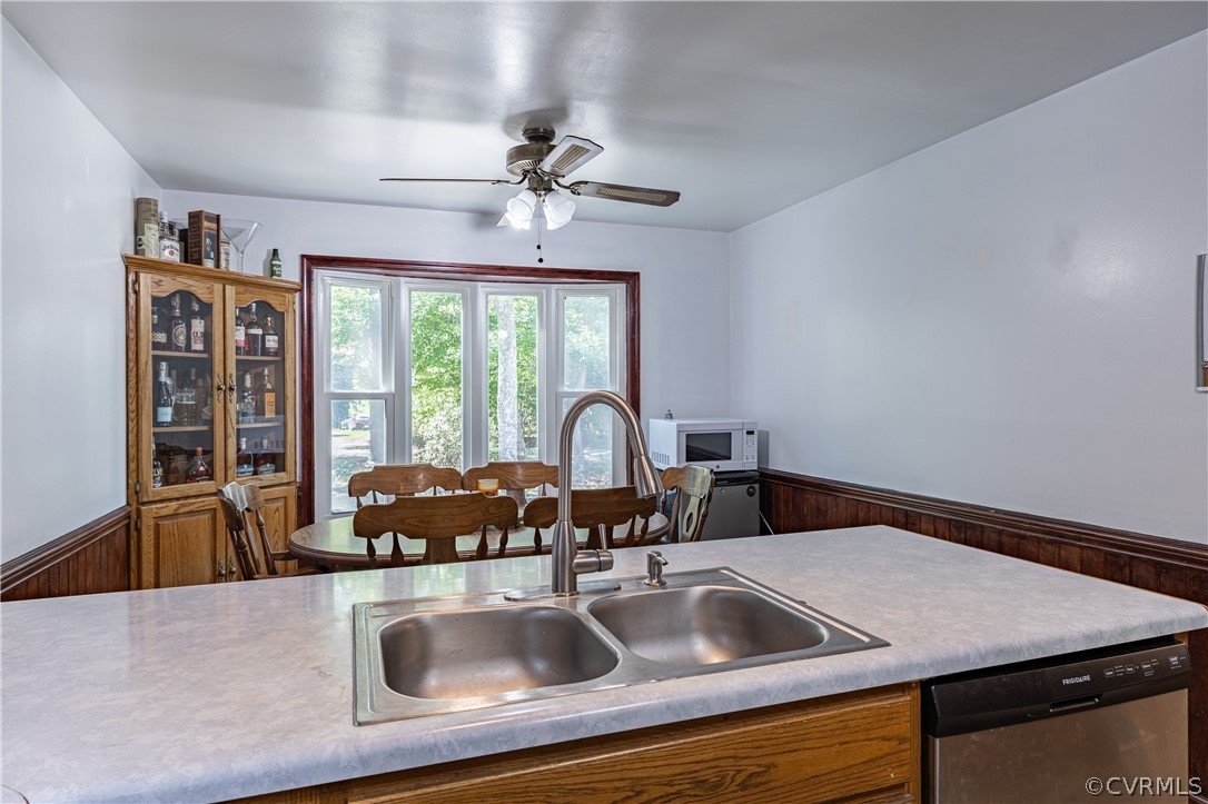 8090 Hungarytown Road Crewe, VA 23930 - Photo 18 of 47 a kitchen with a sink cabinets and a large window