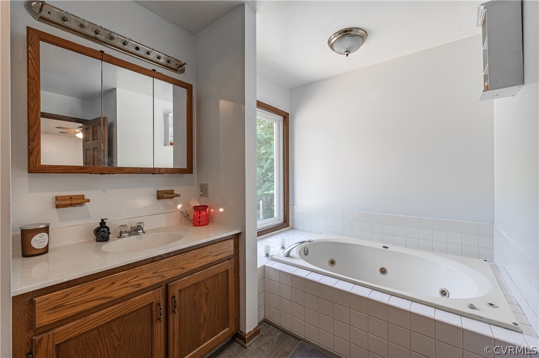 8090 Hungarytown Road Crewe, VA 23930 - Photo 27 of 47 a bathroom with a bathtub sink and mirror