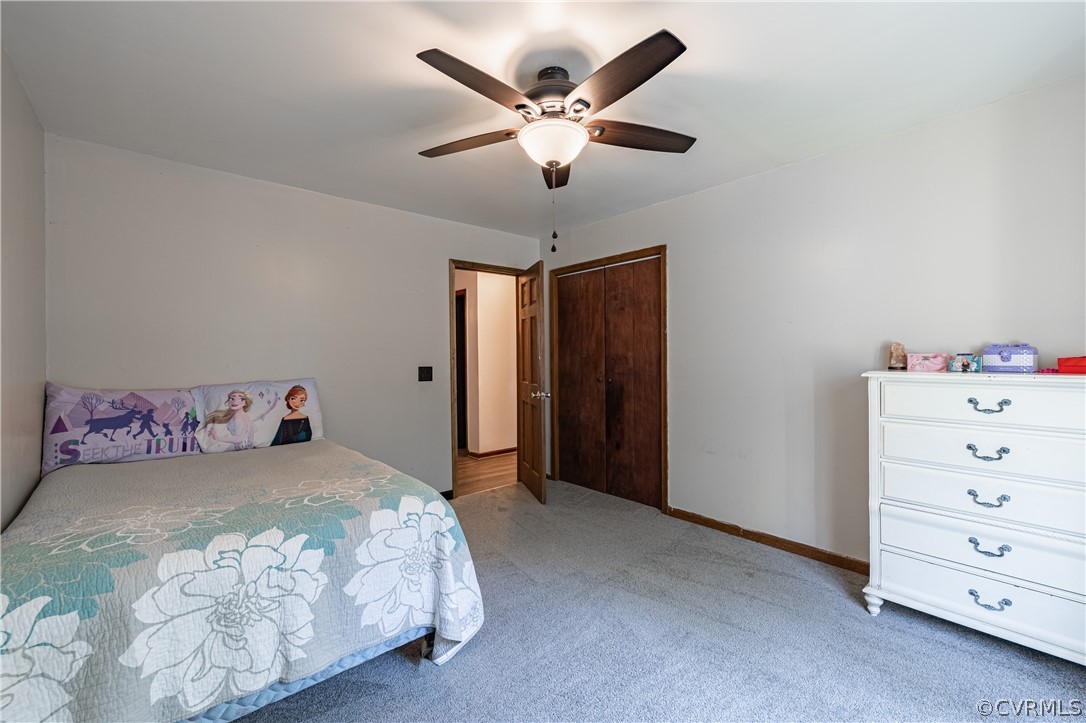 8090 Hungarytown Road Crewe, VA 23930 - Photo 30 of 47 a bedroom with a large bed and a ceiling fan