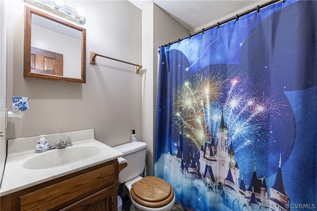 8090 Hungarytown Road Crewe, VA 23930 - Photo 32 of 47 a bathroom with a sink a toilet and shower curtain