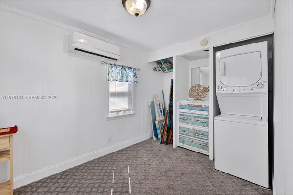 a view of a livingroom with an empty space and a window