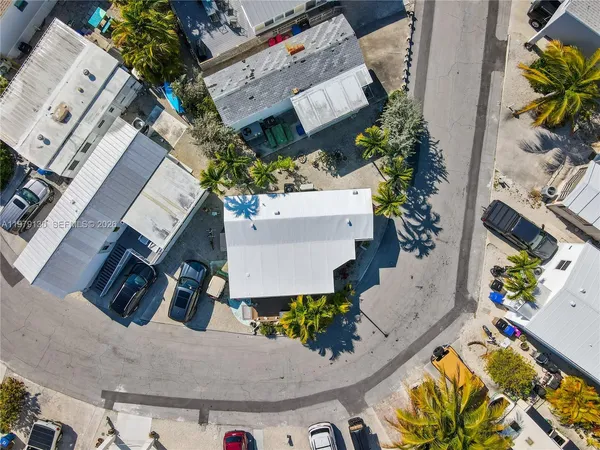 an aerial view of a house with a swimming pool
