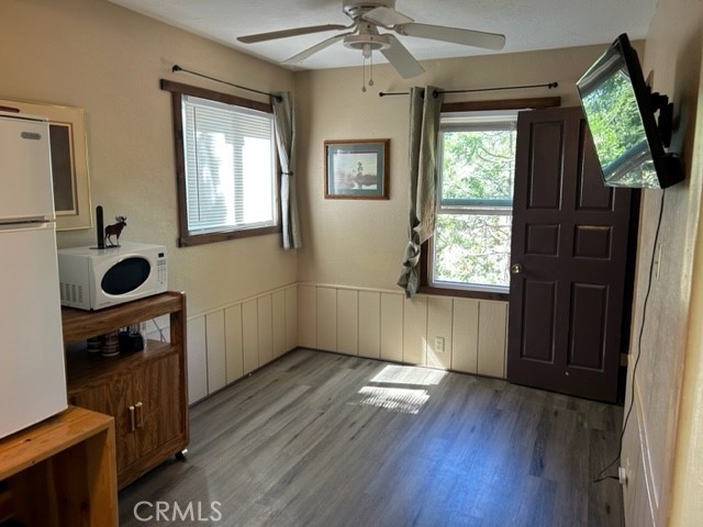 2726 View Drive Running Springs, CA 92382 - Photo 12 of 17 wooden floor in an empty room with a window