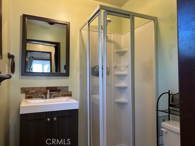 2726 View Drive Running Springs, CA 92382 - Photo 14 of 17 a bathroom with a sink a mirror and a shower
