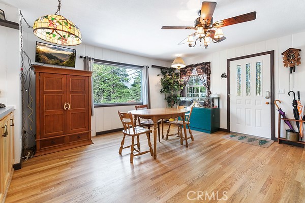 2726 View Drive Running Springs, CA 92382 - Photo 3 of 17 a view of a dining room with furniture window and wooden floor