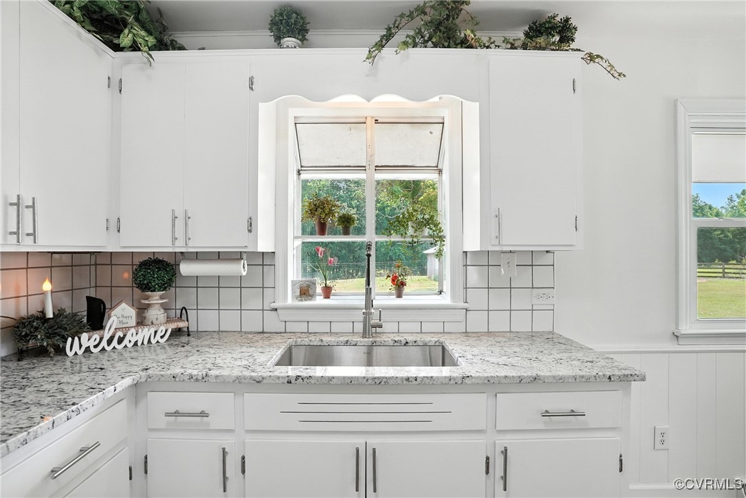 1822 Baughan Road Meherrin, VA 23954 - Photo 15 of 50 a kitchen with granite countertop a sink and a window