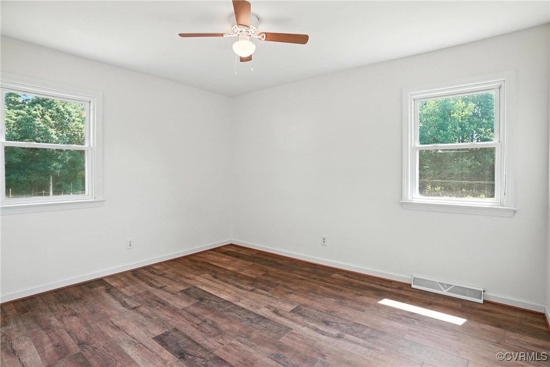 1822 Baughan Road Meherrin, VA 23954 - Photo 19 of 50 a view of empty room with wooden floor and fan