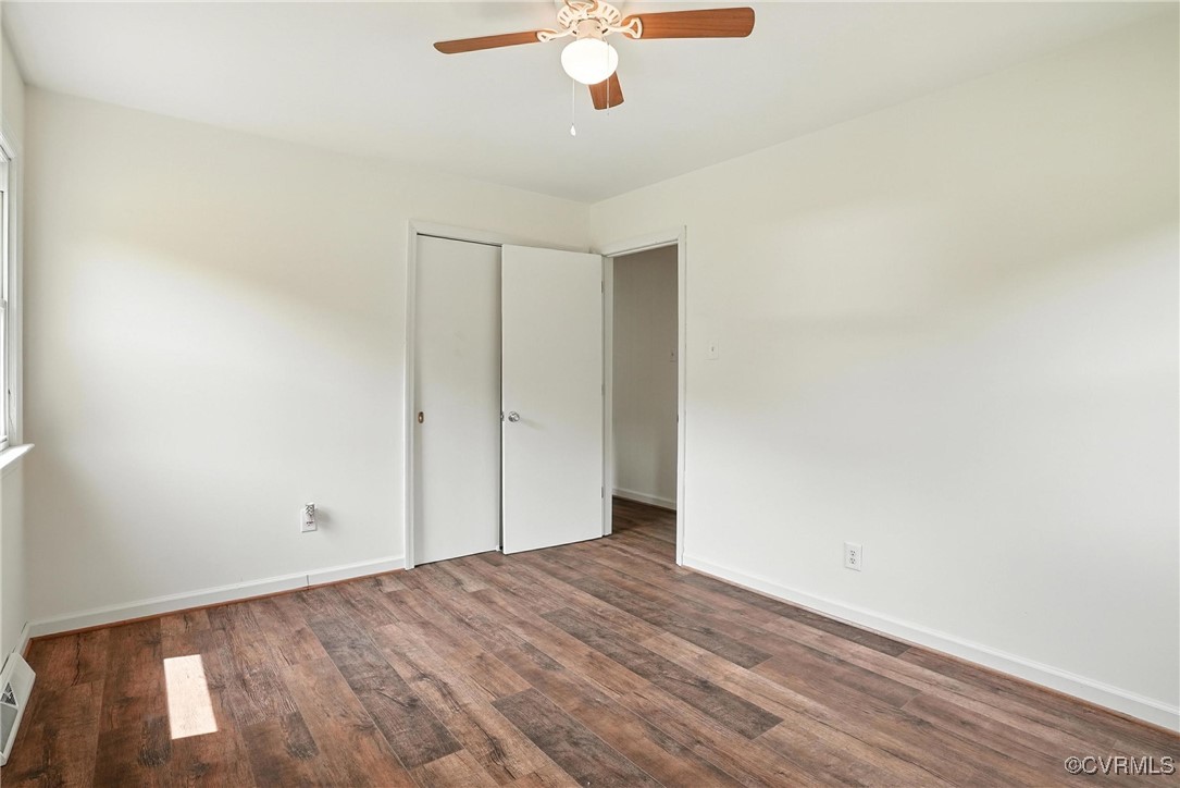 1822 Baughan Road Meherrin, VA 23954 - Photo 20 of 50 a view of a livingroom with wooden floor and a ceiling fan