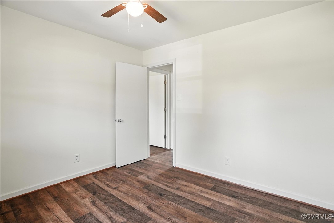 1822 Baughan Road Meherrin, VA 23954 - Photo 23 of 50 an empty room with wooden floor and ceiling fan
