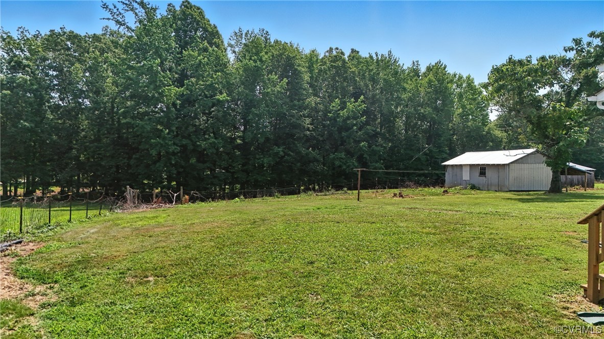 1822 Baughan Road Meherrin, VA 23954 - Photo 35 of 50 a backyard of a house with table and chairs