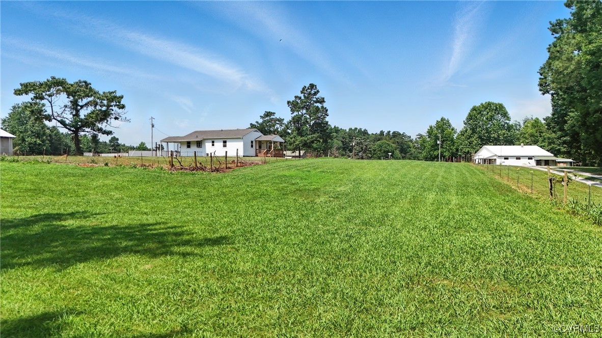 1822 Baughan Road Meherrin, VA 23954 - Photo 41 of 50 a view of a big yard with plants and a garden