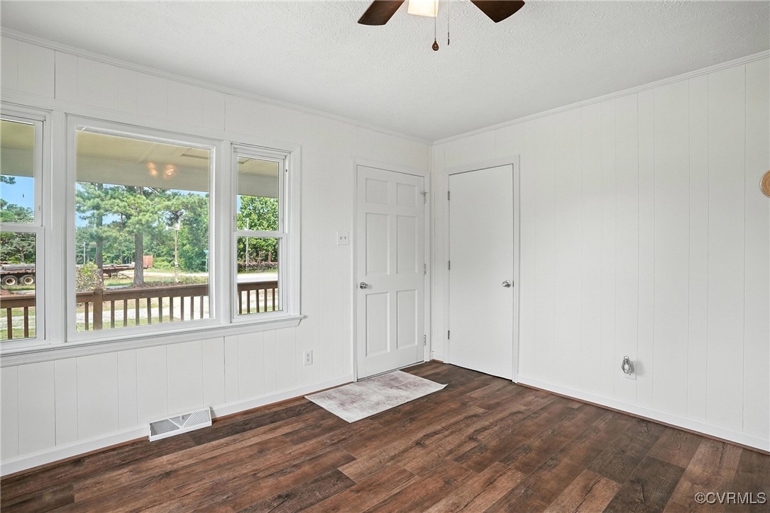 1822 Baughan Road Meherrin, VA 23954 - Photo 5 of 50 a view of an empty room with wooden floor and a window