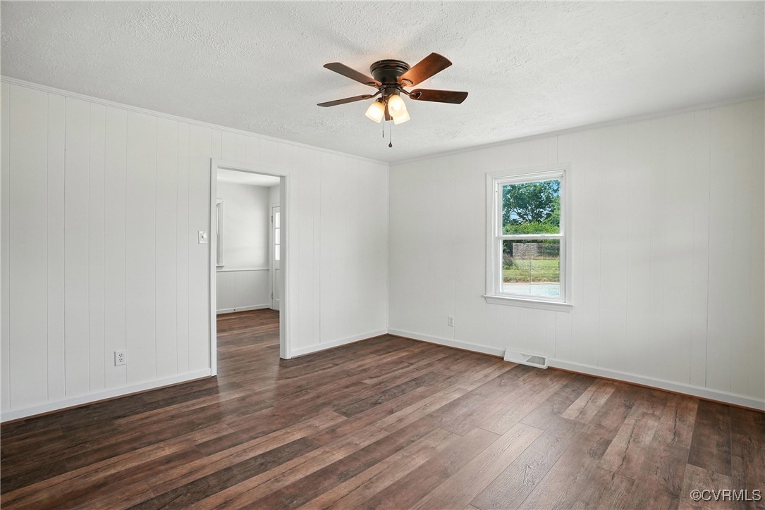 1822 Baughan Road Meherrin, VA 23954 - Photo 6 of 50 an empty room with wooden floor and windows
