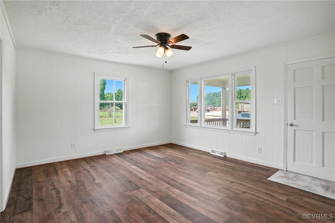 1822 Baughan Road Meherrin, VA 23954 - Photo 8 of 50 a view of an empty room with wooden floor and a window