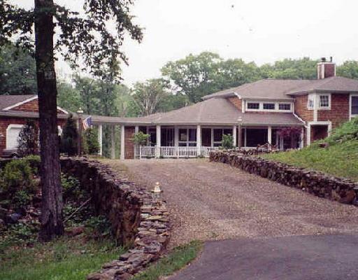 23 Old Woods Road Brookfield, CT 06804 - Photo 1 of 1 a front view of a house with a garden