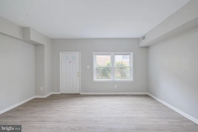 an empty room with windows