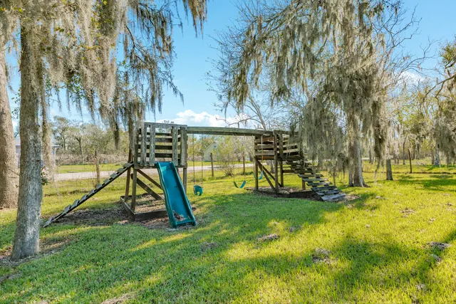 a view of a park with swings and slides