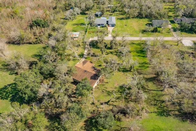 an aerial view of house with a swimming pool