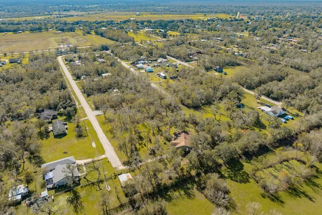 an aerial view of house with yard