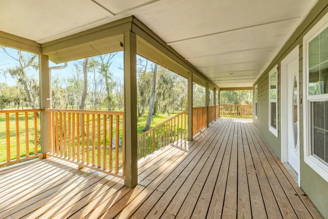 a view of a balcony with wooden floor