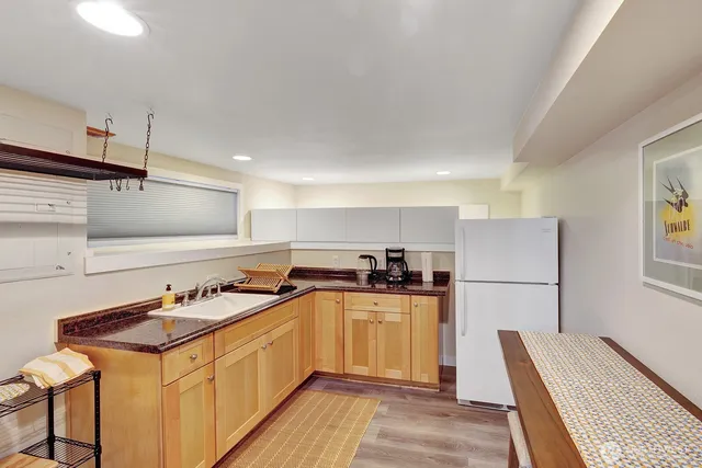 a kitchen with a sink a stove and refrigerator