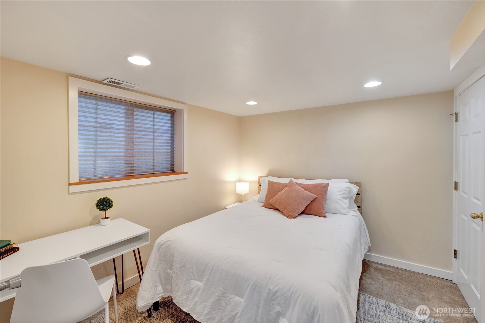 7911 5th Avenue Northeast, Unit 2 Seattle, WA 98115 - Photo 5 of 11 a bedroom with a bed and a window