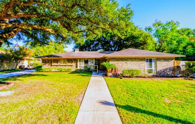 a front view of a house with swimming pool