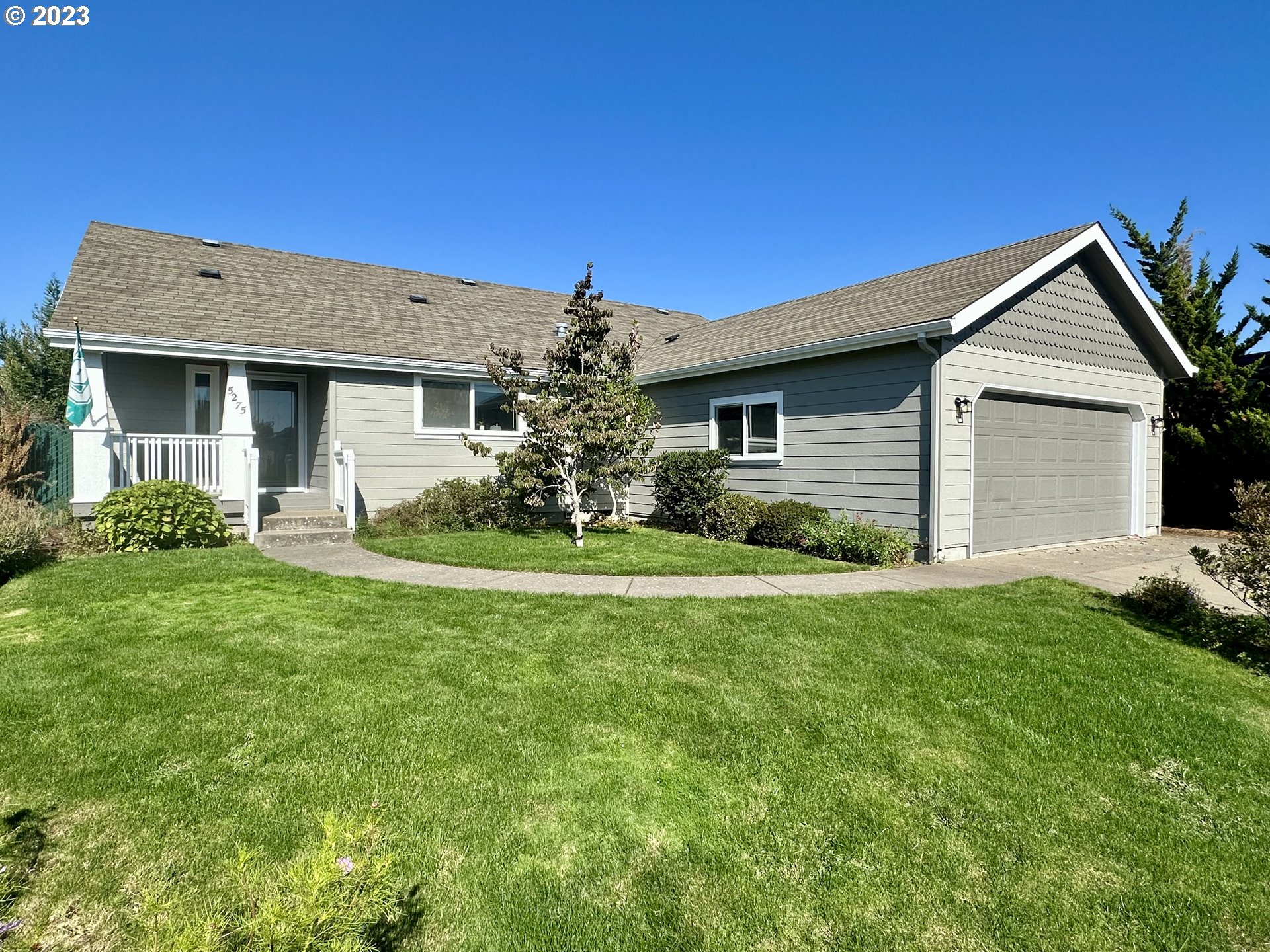 5275 Bridgewater Drive Eugene, OR 97402 - Photo 1 of 18 a front view of a house with a yard