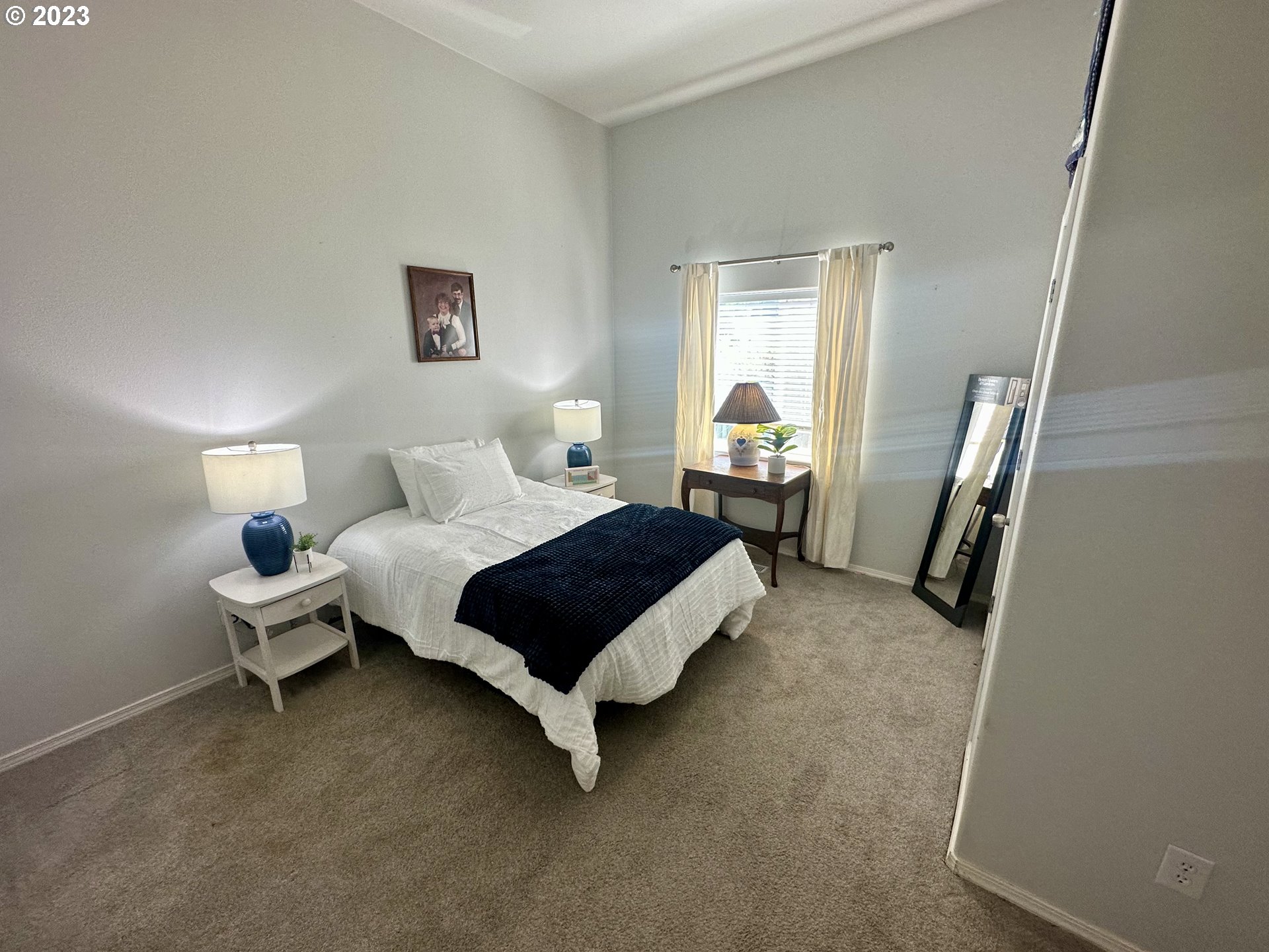 5275 Bridgewater Drive Eugene, OR 97402 - Photo 15 of 18 a spacious bedroom with a bed and wooden floor