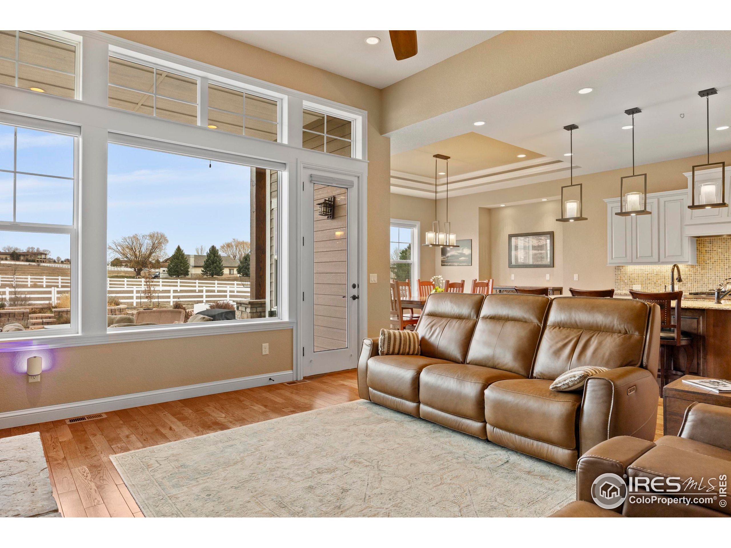 39884 Ridgecrest Court Severance, CO 80610 - Photo 12 of 44 a living room with furniture and a large window