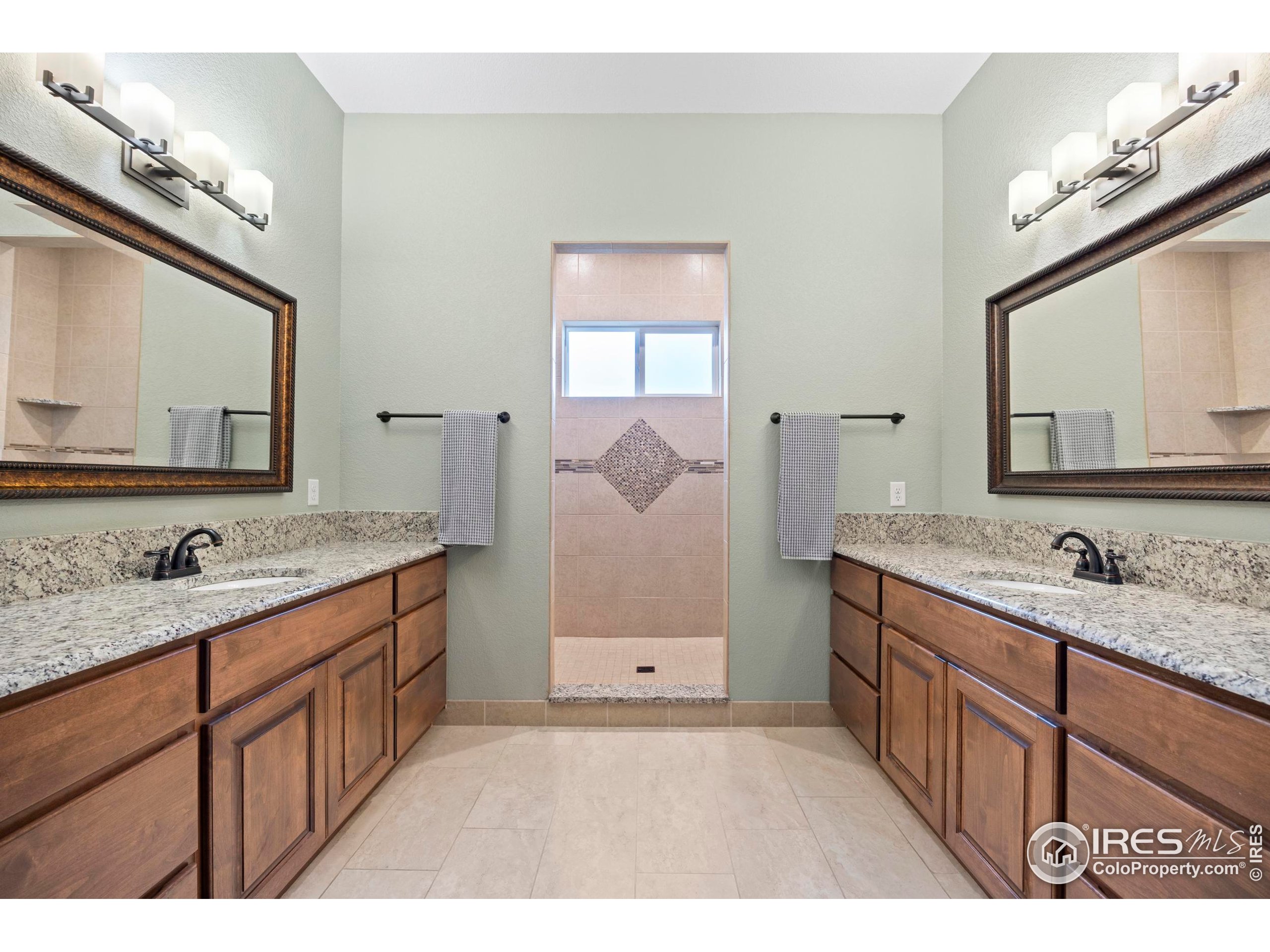 39884 Ridgecrest Court Severance, CO 80610 - Photo 20 of 44 a bathroom with a sink double vanity granite and a mirror