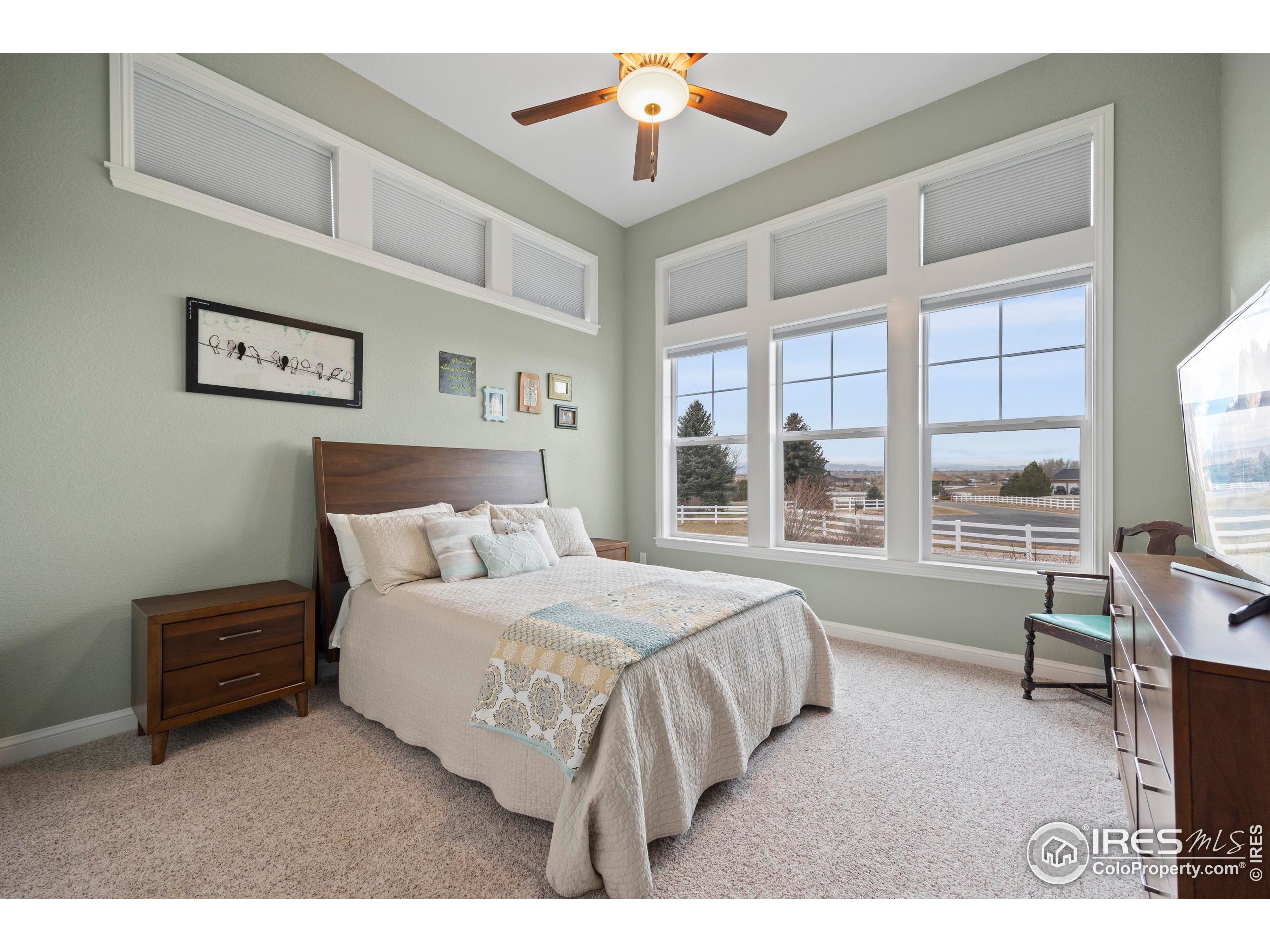 39884 Ridgecrest Court Severance, CO 80610 - Photo 23 of 44 a living room with a bed furniture and a flat tv screen