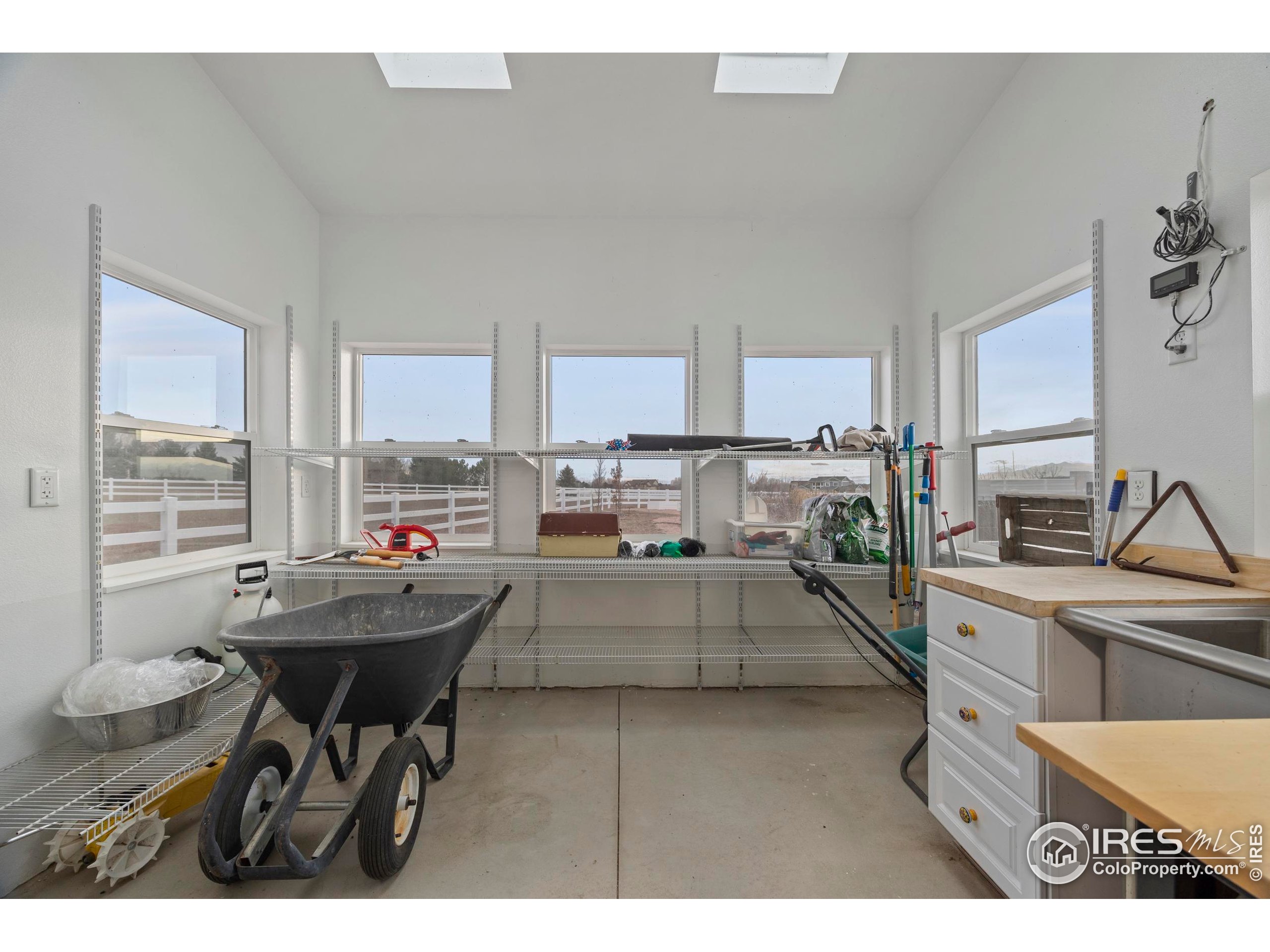 39884 Ridgecrest Court Severance, CO 80610 - Photo 39 of 44 a kitchen with stainless steel appliances kitchen island granite countertop a sink and cabinets