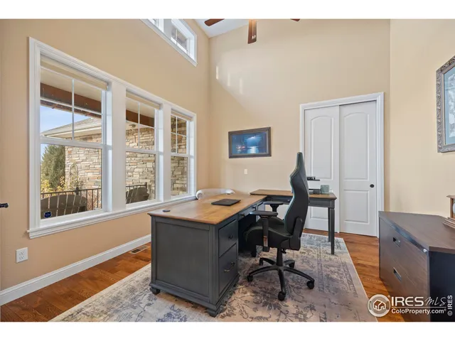 a workspace with furniture and window