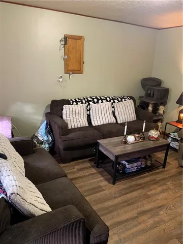 a living room with furniture and a rug