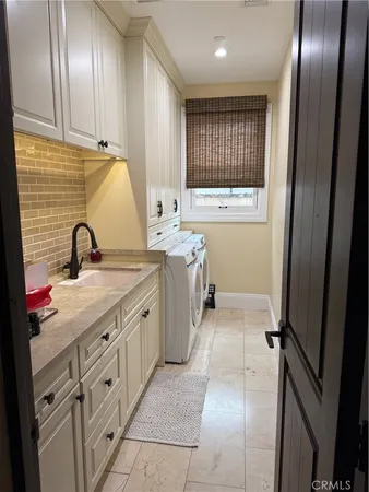 a bathroom with a sink double vanity and a mirror