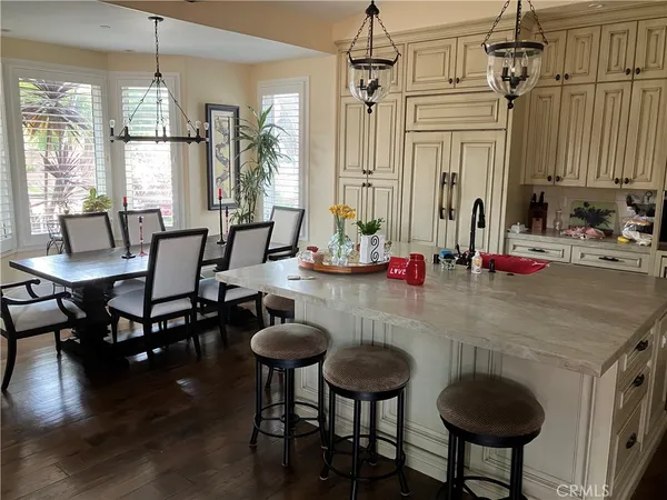 a dining room with furniture and window