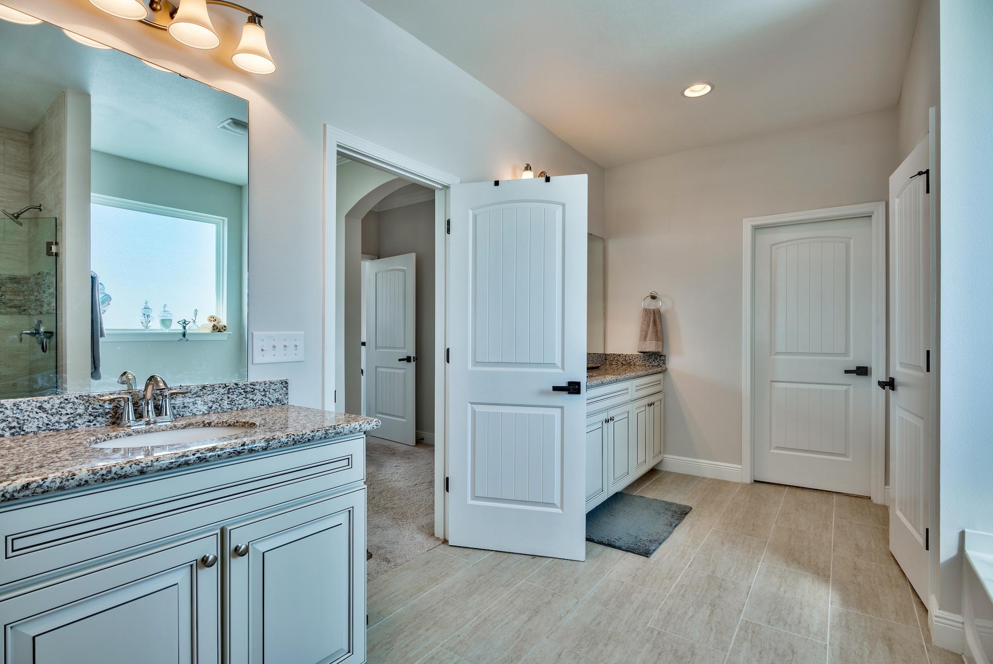 20 Inlet Cove Inlet Beach, FL 32461 - Photo 27 of 50 a spacious bathroom with a granite countertop double vanity sink a mirror and a