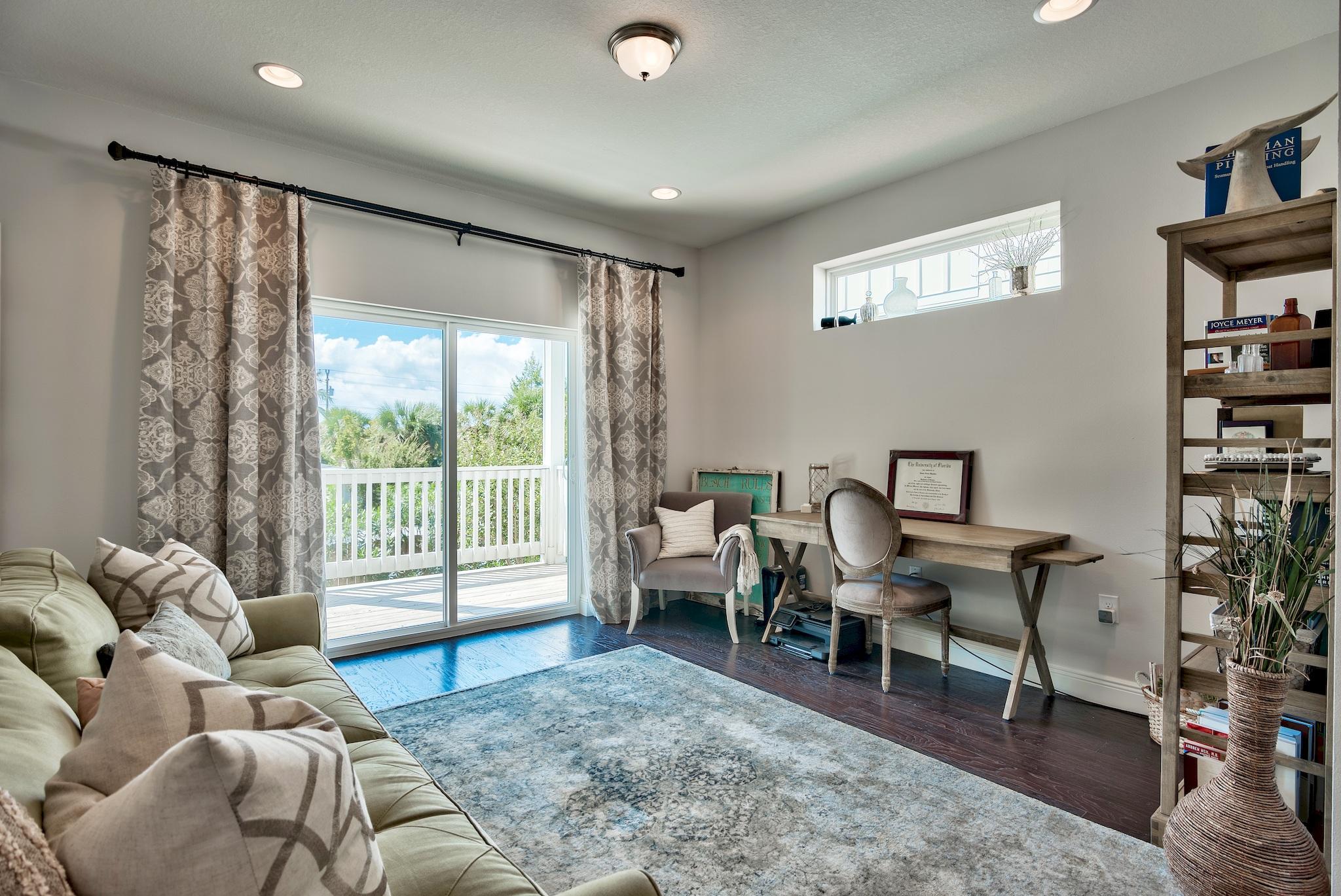 20 Inlet Cove Inlet Beach, FL 32461 - Photo 32 of 50 a living room with furniture and a flat screen tv