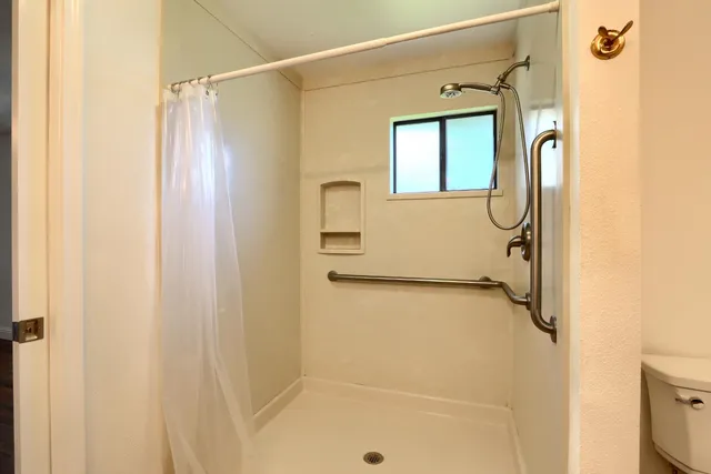 a bathroom with a sink double vanity and a mirror